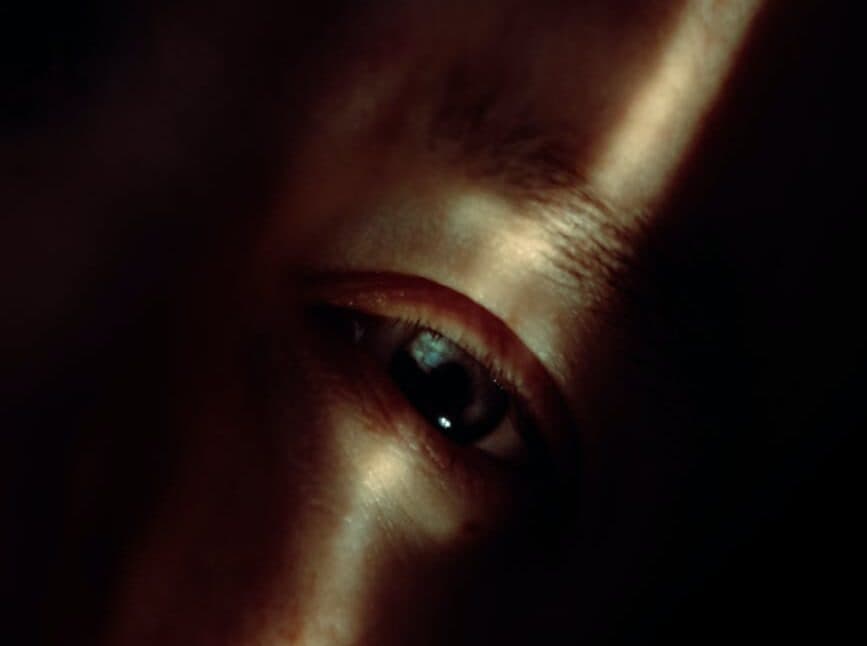 crop person with green eyes in sunlight